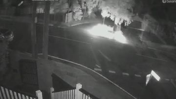 CCTV footage shows the mystery man pulling up on Clyde Street in Herston, dropping off the object, and driving away before sparks filled the air just before 3am.﻿