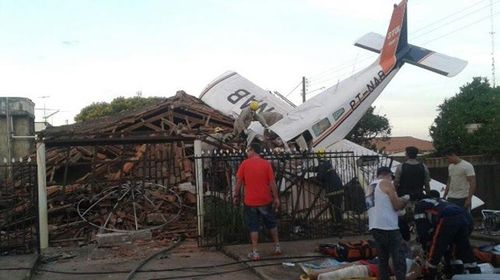 Plane crashed onto house, kills two