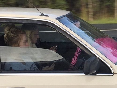 Woman snapped using phone at 110km/h on Queensland highway