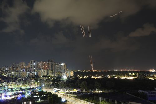Rockets fired from the Gaza Strip are seen from Ashkelon, Israel, Friday, Oct.13, 2023.  