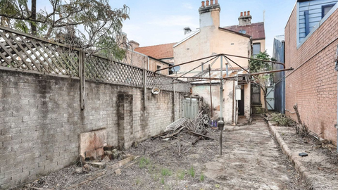 Neglected Redfern terrace sold for $1.25 million at auction.