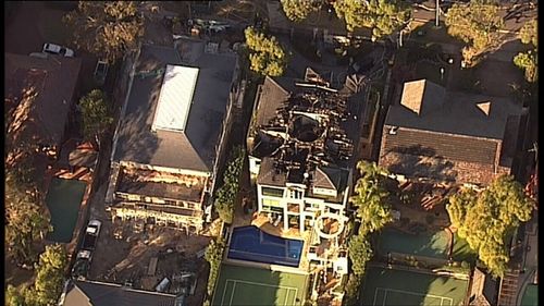 Five people escape from the home after they awoke to the sound of a fire alarm (9NEWS)