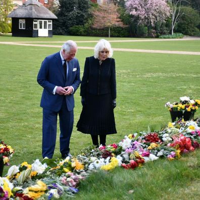 Prince Charles and Camilla, Duchess of Cornwall view floral tributes left for Prince Philip at Marlborough House Gardens