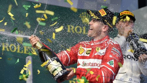 Sebastian Vettel celebrates his 2017 win. (AAP)