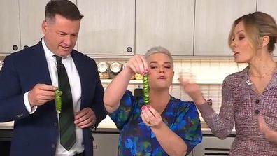 Karl Stefanovic and Jane de Graaff try the 'springy' cucumber trick.