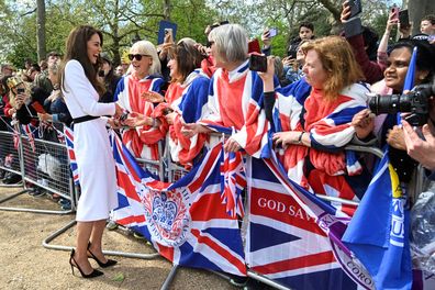 Catherine, Princess of Wales, meets well-wishers during a walkabout on the Mall outside Buckingham Palace ahead of the coronation of Britain's King Charles and Camilla, Queen Consort on May 5, 2023 in London 