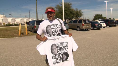 A Trump supporter selling some questionable t-shirts. (Laura Turner/9NEWS)