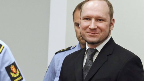 In this  2012 file photo, confessed mass killer Anders Behring Breivik smiles as he arrives in the courtroom, in Oslo, Norway. 