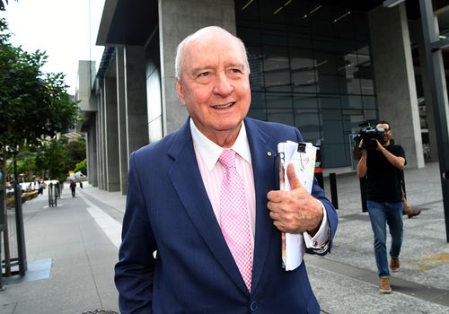 Jones presented a cheery facade after day one of his defamation case despite the allegations against him. (AAP)