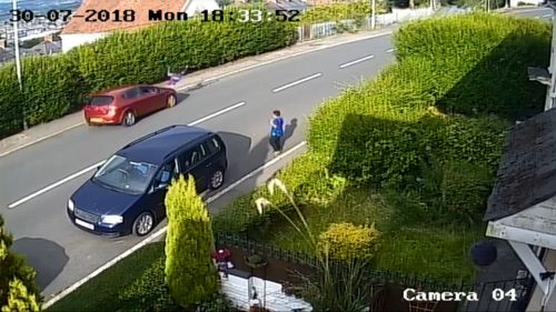 The young boy is sent flying in the air as he runs in front of the passing car.