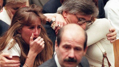 Fred Goldman, father of Ron Goldman, hugs his wife Patti, as his daughter, Kim, left, reacts during the reading of the not guilty verdicts in the O.J. Simpson double-murder trial in Los Angeles in 1995. Simpson was acquitted in the murders of Goldman and Simpson's ex-wife Nicole. 