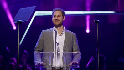 Britain's Prince Harry gives a speech on stage before announcing the winners of the Health and Wellbeing category at the inaugural OnSide Awards at the Royal Albert Hall in London, Sunday, Nov. 17, 2019. 