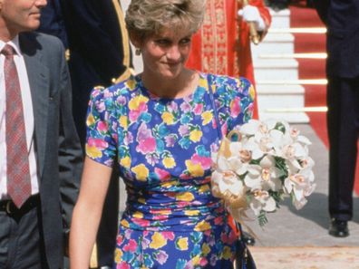 SPAIN - MAY 21:  Diana, Princess of Wales outside the Town Hall in Seville with bodyguard Colin Trimming, She is wearing a dress designed by fashion designers Bellville Sassoon  (Photo by Tim Graham Photo Library via Getty Images)