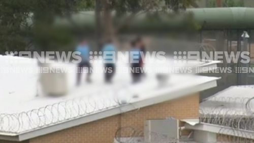 A handful of detainees have spent more than six hours atop a roof at a western Sydney juvenile justice centre.