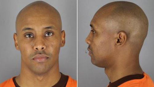 Former police officer Mohamed Noor, pictured after his arrest, shot from the squad car across his partner and killed her.