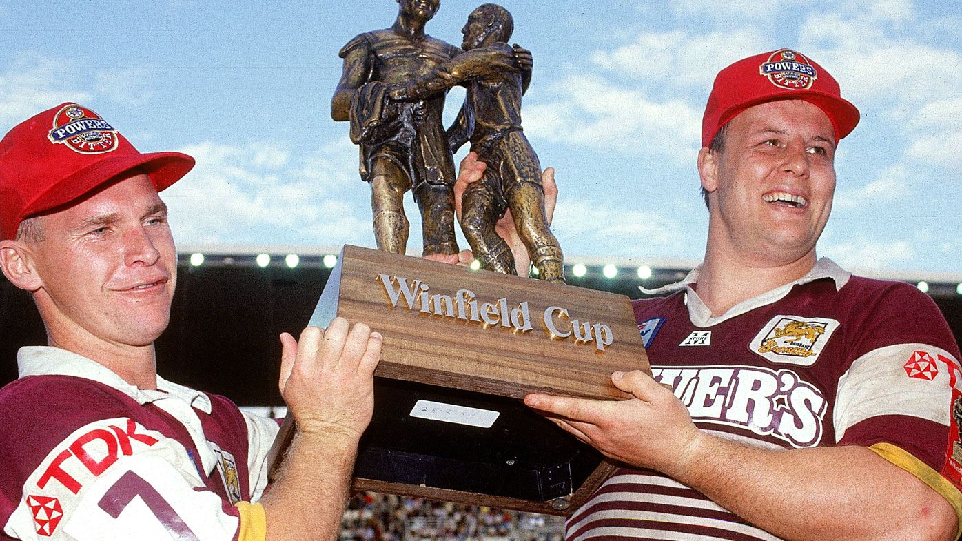 Allan Langer and Glenn Lazarus of the Broncos holds aloft the premiership trophy after winning the 1992 NSWRL Grand Final (Getty)
