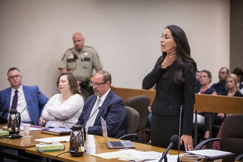 Prosecutor Christina Warren describes the noose that was put around the 16-month old boy's neck during the sentencing hearing for Nataliia Karia, second from left, in Hennepin County District Court in Minneapolis, Monday, July 16, 2018. Karia, a Minneapolis day care owner, was sentenced to 10 years of probation for trying to kill a toddler in her home by hanging him from a noose. She received her punishment after pleading guilty to attempted murder and third-degree assault earlier. (Leila Navidi/Star Tribune via AP)