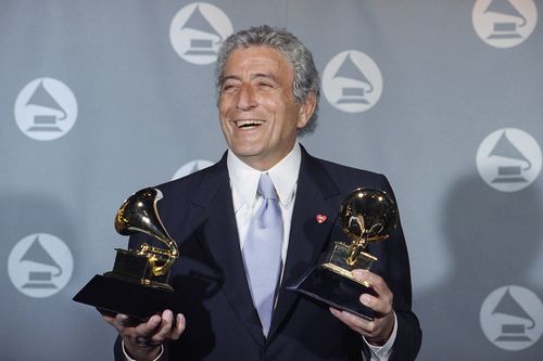 Veteran singer Tony Bennett displays his two Grammy's backstage at the Shrine Auditorium in Los Angeles Wednesday, March 1, 1995.  