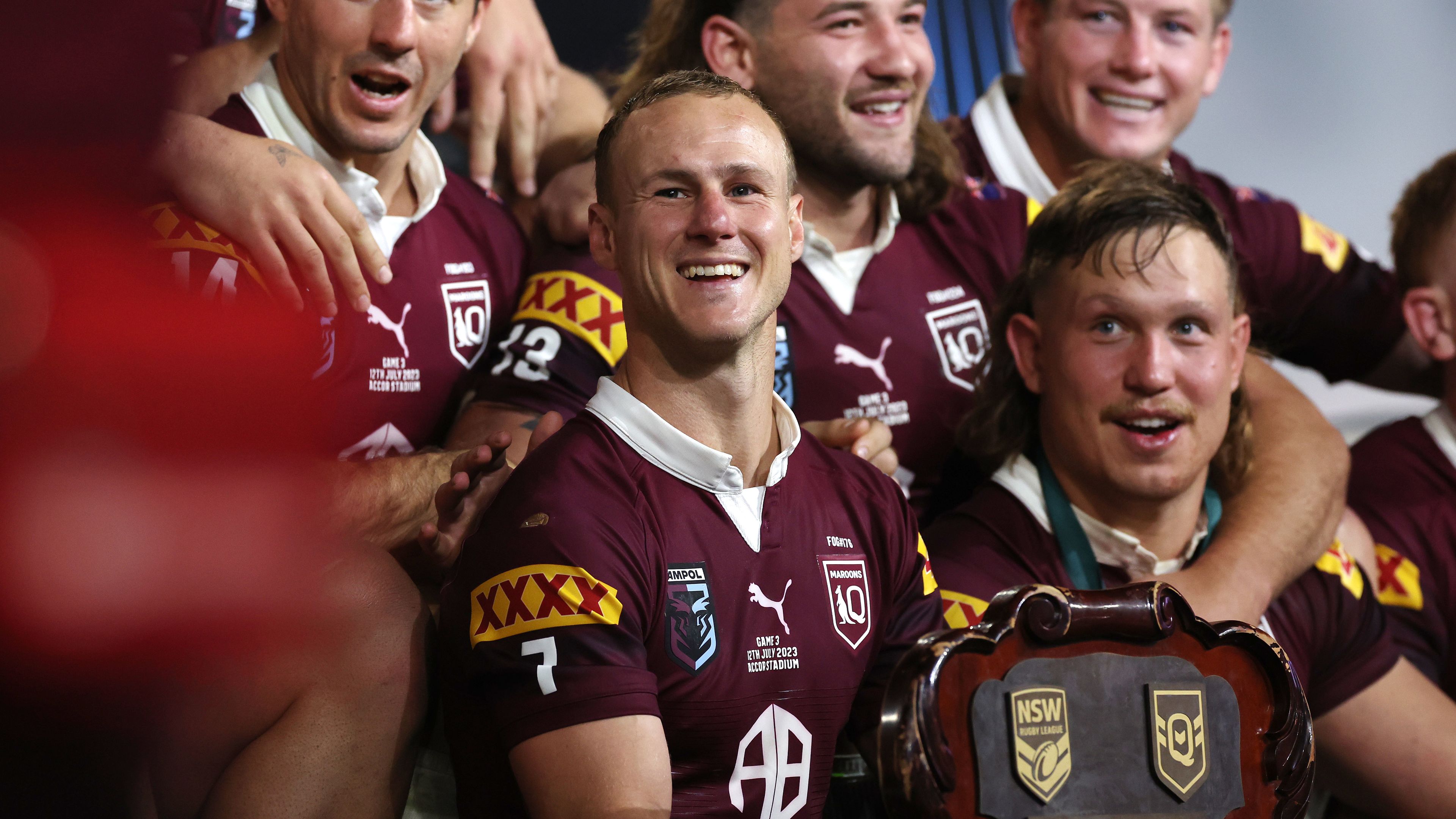 Daly Cherry-Evans of the Maroons celebrates with team mates after winning the series 2-1 after game three of the State of Origin series.