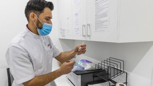 A pharmacist preparing a Covid-19 vaccine.