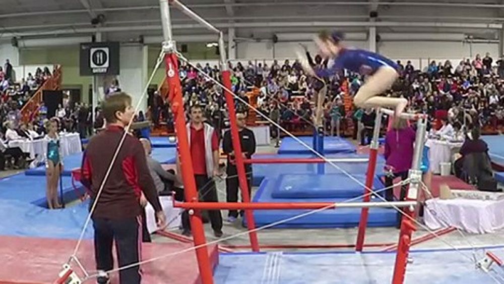 Coach makes acrobatic catch to save gymnast