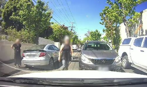 After neither driver refused to budge, the woman gets out of her car and begins yelling at the man. (Supplied)