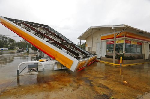 The metal canopy at a petrol station is shown after it was overturned by high winds brought on by Hurricane Irma. (AP)