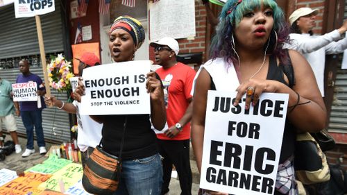 Protesters gather at the spot where Eric Garner died in July. (Getty Images)