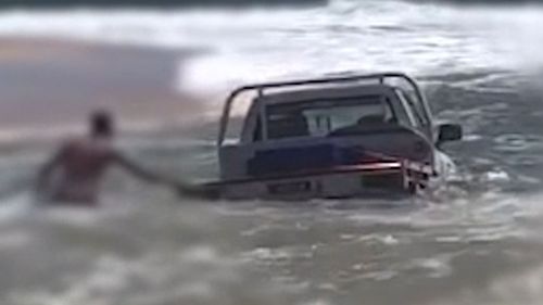 The Nissan Patrol immediately became submerged by the waves.