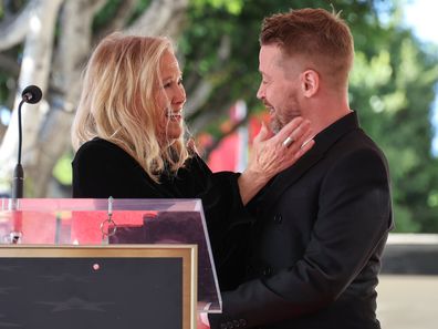 Catherine O'Hara and Macaulay Culkin speak onstage during the ceremony honoring Macaulay Culkin with a Star on the Hollywood Walk of Fame on December 01, 2023