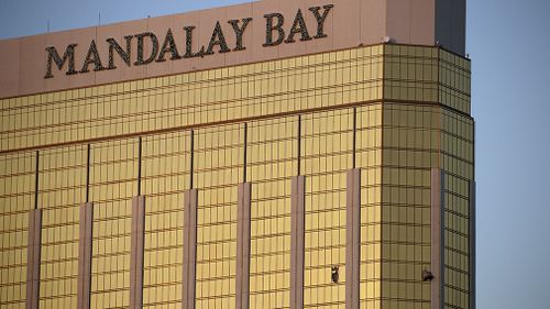 Shattered windows are seen at the Mandalay Bay resort, blown out when Paddock opened fire at the crowd below. (AP)