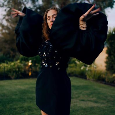 Adele looks happy and carefree in new photos as she marks 34th birthday.