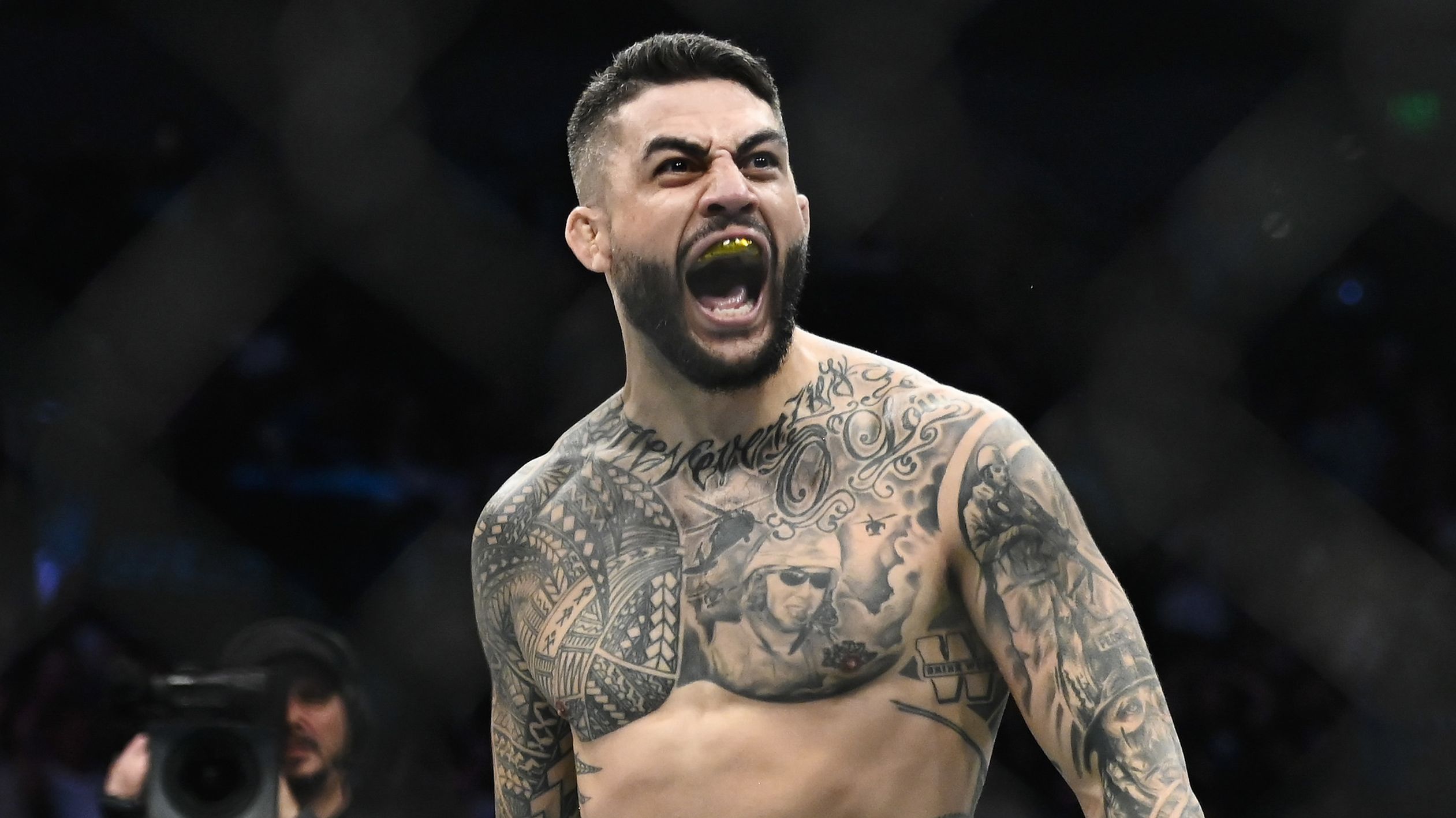 Tyson Pedro of Australia celebrates after defeating Harry Hunsucker of the United States in a light heavyweight bout during UFC 278 at Vivint Arena.