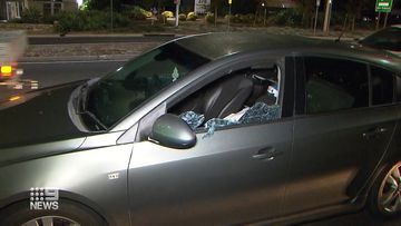 South Australia police smashed the window of a car to get to a man suspected of committing a string of armed robberies in Adelaide. 