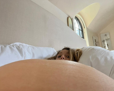 Blake Lively shares photos of her baby bump as she expects her fourth child with husband Ryan Reynolds.