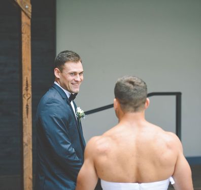 Bride pranks groom with best man wearing a wedding dress