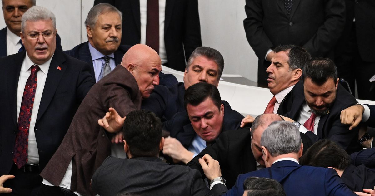 Punches thrown by politicians in chaotic brawl in parliament