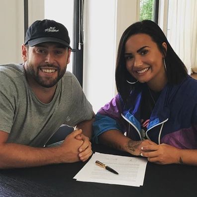 Scooter Braun and Demi Lovato