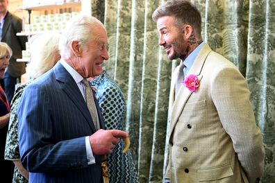 David Beckham, wearing the King's Rose, with King Charles and Queen Camilla during a visit to the Chelsea Flower Show on Monday May 19, 2025.