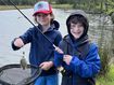 Ben and ﻿his older brother Russell, pictured fishing on the banks of a river.