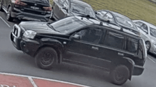 A black Nissan X-Trail allegedly mounted the footpath in Craigieburn, Melbourne to drive at a man the driver earlier had an altercation with.