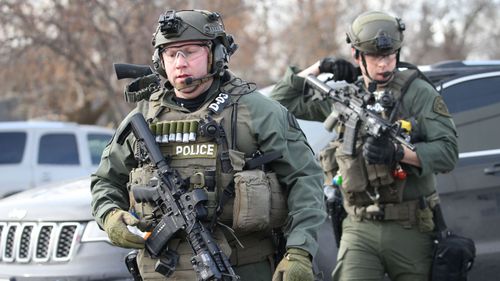 Heavily armed police arrive on the scene of the shooting. Picture: Getty