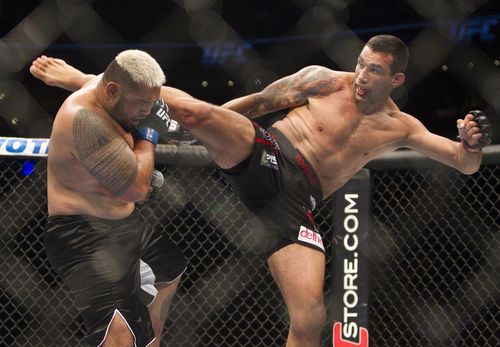 New Zealand's Mark Hunt, left, battles against Brazil's Fabricio Werdum in Mexico City in 2014. (AAP)