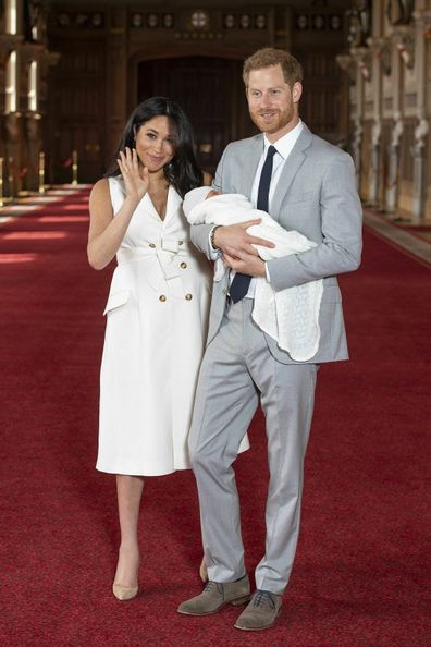 Prince Harry and Meghan, Duchess of Sussex, during a photocall with their newborn son, in St George's Hall at Windsor Castle.