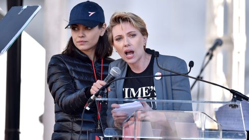 Mila Kunis holds the microphone as Scarlett Johansson adresses the crowd. (PA)