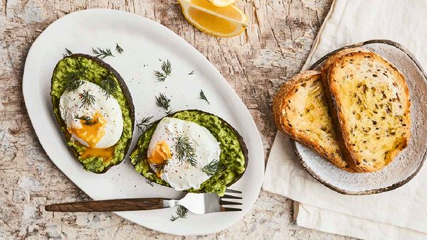 Avocado smash on toast with poached eggs. Healthy breakfast