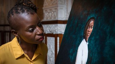 The painting of Bonetta by artist Hannah Uzor (pictured with painting) is on display at Osborne throughout October during Black History Month.