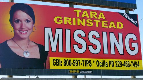 An image of Tara Grinstead is displayed on a billboard.