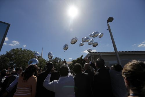 Seventeen balloons were released at the vigil last night. Picture: AAP