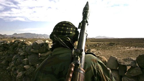 An Afghan National Army soldier looks towards the Pakistani border.